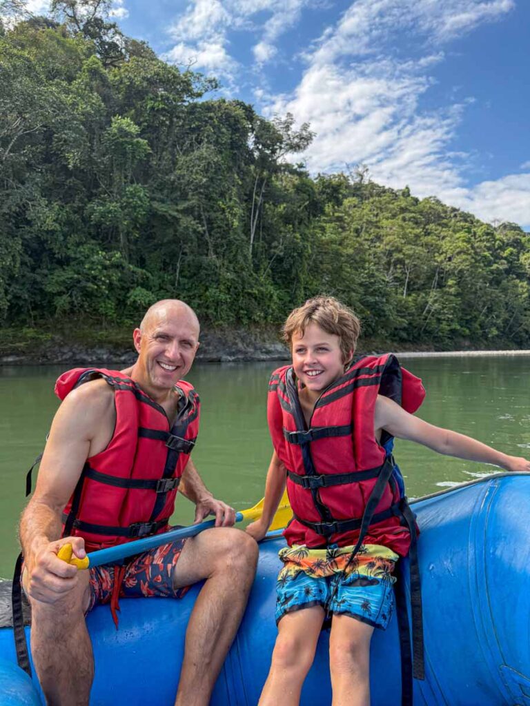 Dan Brewer, owner of FamilyCanTravel.com, enjoys a white water rafting trip with his 9-year old son on a family-friendly tour of Manu National Park.
