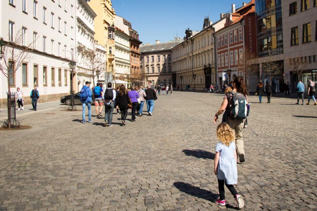 Celine Brewer, owner of the Family Can Travel blog, enjoys a tour of Old Town with her daughter while on a family vacation to Prague.