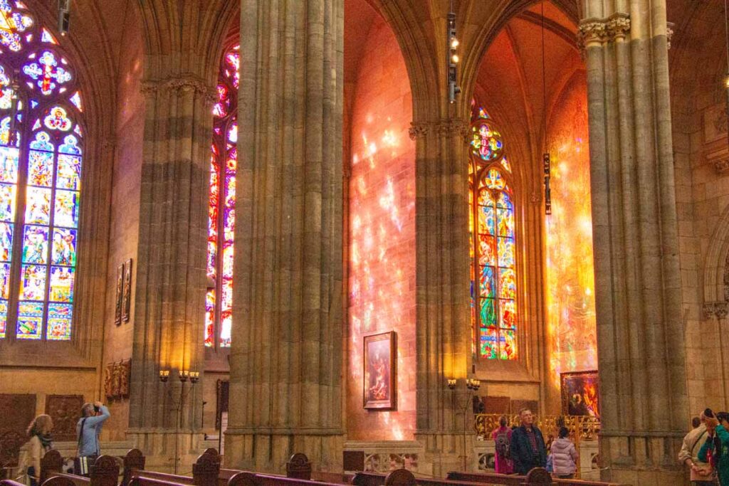Beautifully lit stained glass at the Prague Castle.