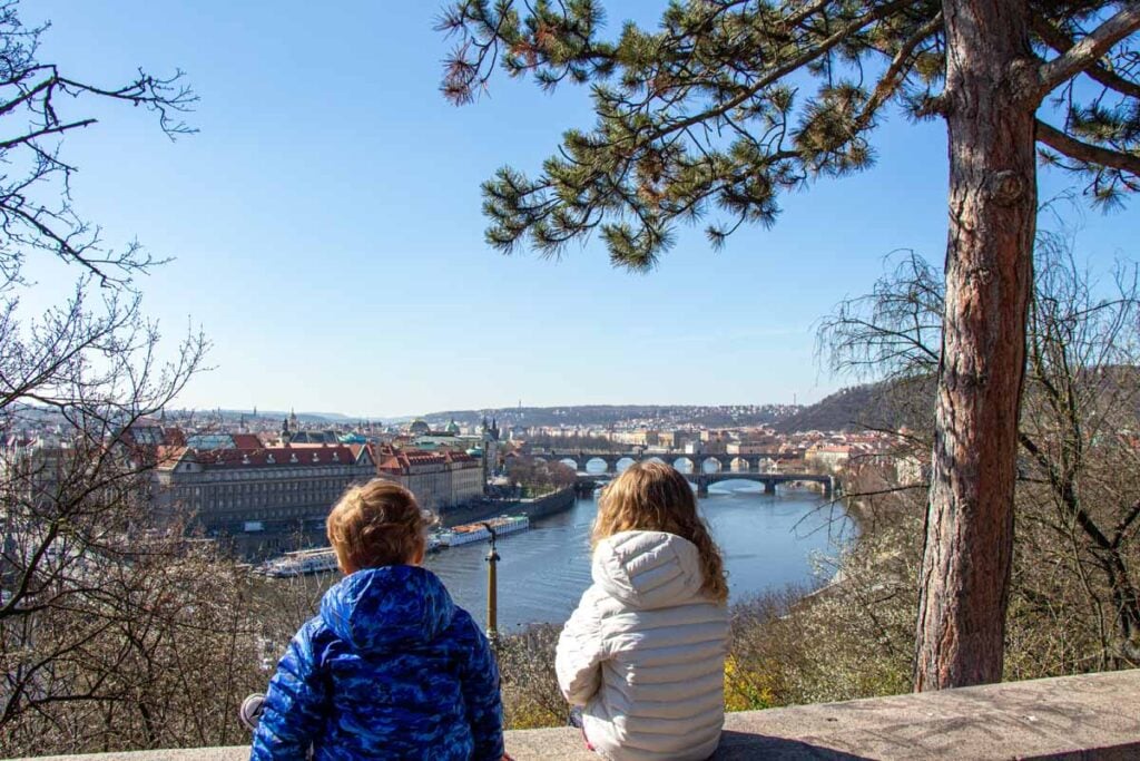 The Brewer kids, from the FamilyCanTravel.com blog, enjoy a view of Prague from an easy family walk in Letna Park.