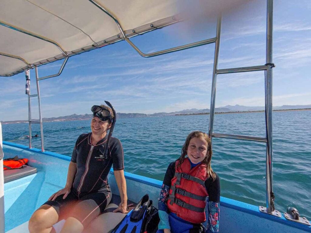 Celine Brewer, owner of FamilyCanTravel.com, prepares to go snorkeling with whale sharks on a family trip to La Paz, Mexico with kids.