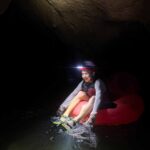 Family friendly Things to do in San Ignacio Belize - Cave Tubing Tour Blue Hole National Park a 10-year old boy on a family trip to San Ignacio, Belize enjoys a cave tubing tour in Blue Hole National Park.