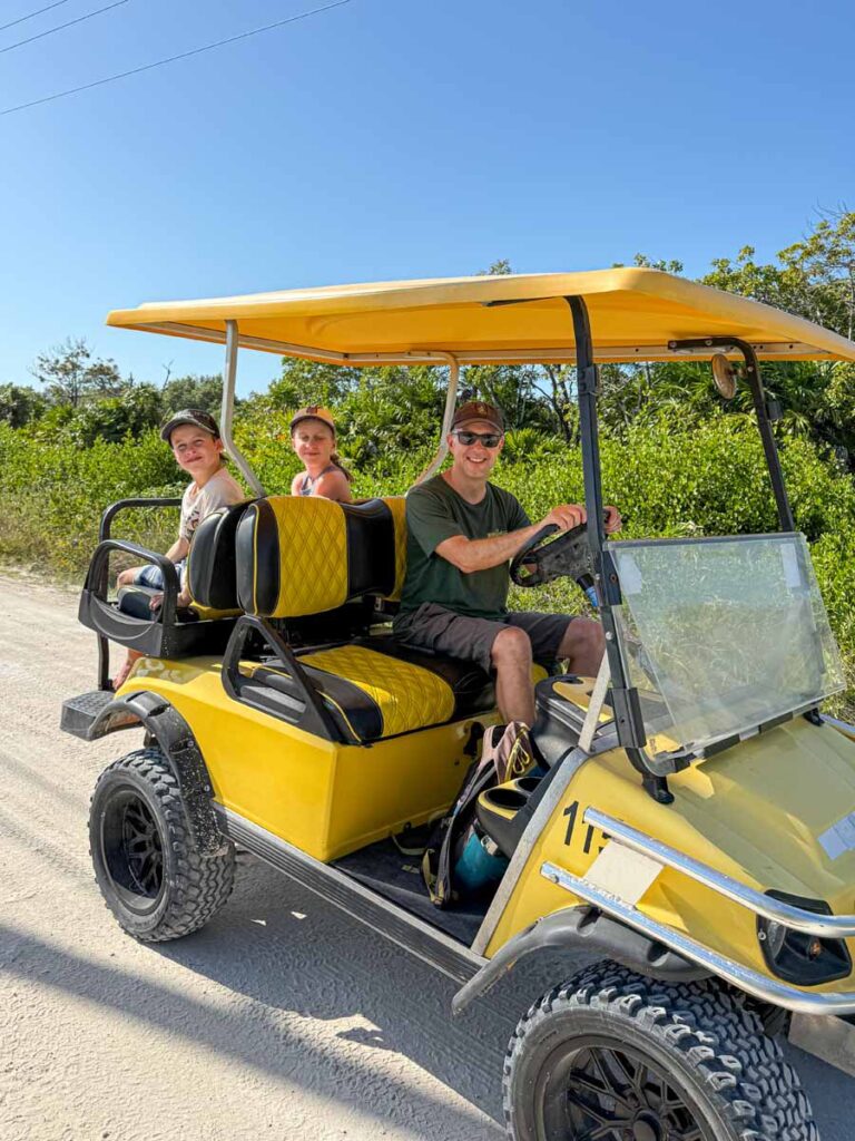 Dan Brewer and his kids in a rental golf cart on Ambergris Caye, Belize.