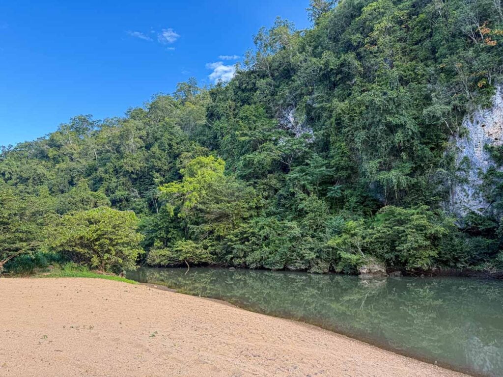 The Sweet Songs Lodge features a real sand beach on the Macal River, where the river is tranquil enough to swim.