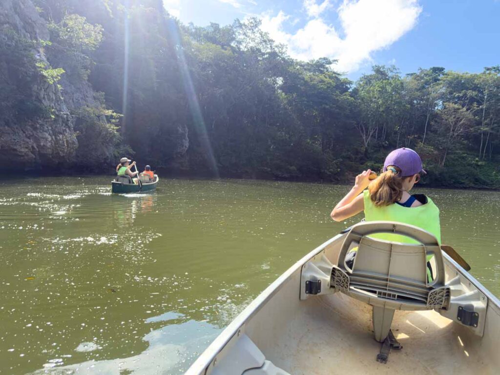 The Brewer family, from the Family Can Travel blog, enjoys complimentary canoeing during their 5-night stay at the Sweet Songs Lodge in San Ignacio, Belize.