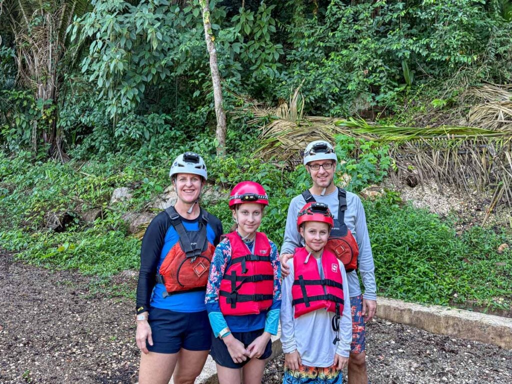 The Brewer family, from FamilyCanTravel.com, stands in their caving gear before beginning the ATM Cave Tour near San Ignacio, Belize.