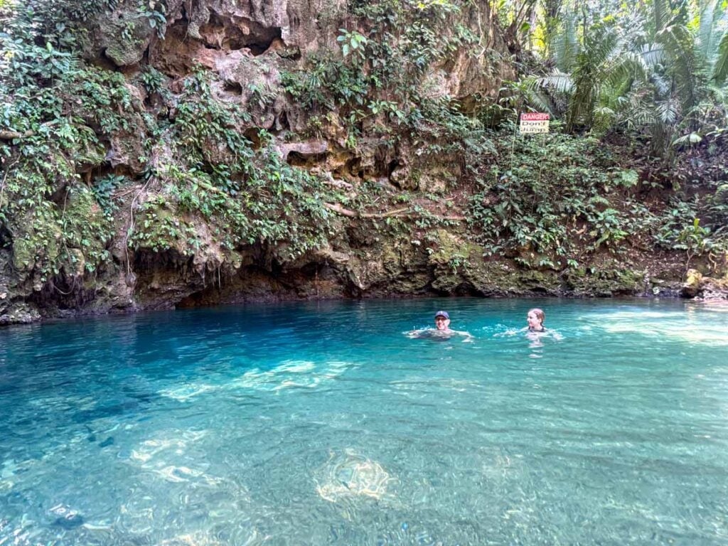 Dan Brewer, owner of FamilyCanTravel.com, enjoys a refreshing swim in the inland Blue Hole during a family trip to San Ignacio, Belize.