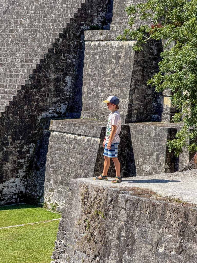a 10-year old boy from the Brewer family, explores the Tikal ruins during a family trip to San Ignacio, Belize.