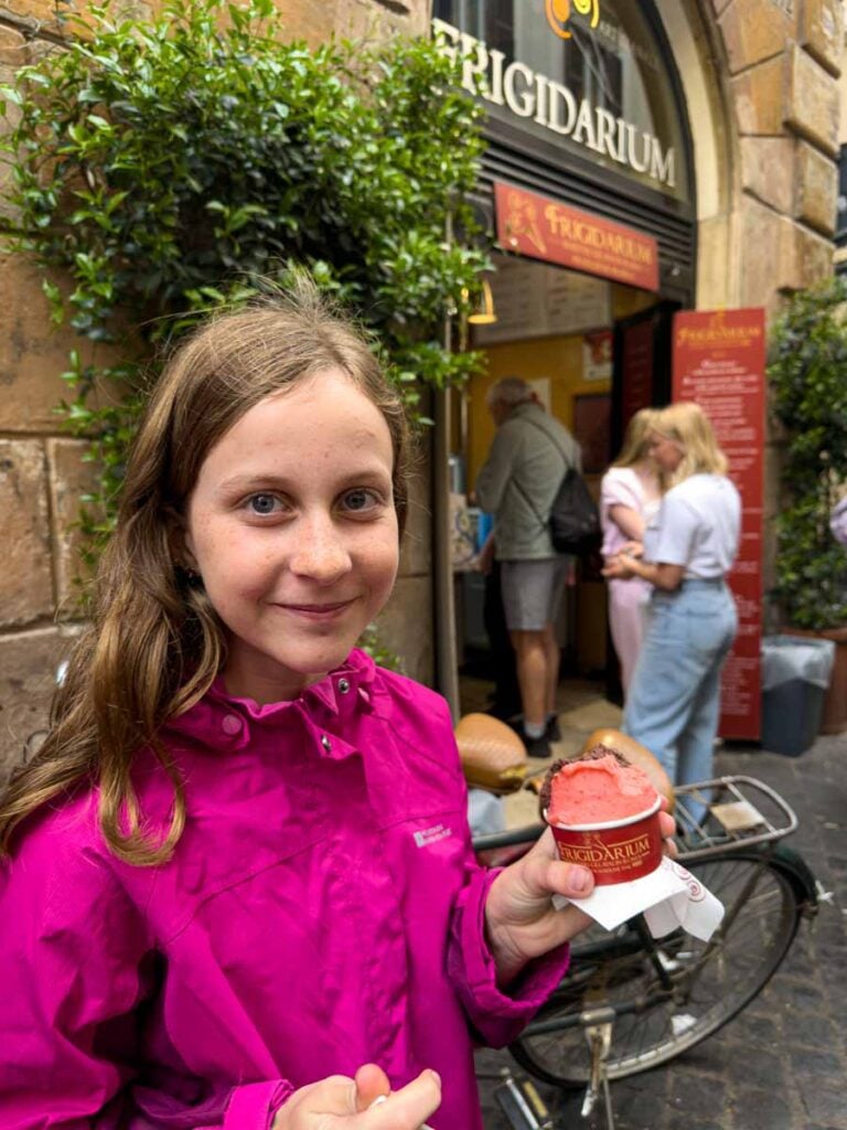 a 12-year old girl enjoys a gelato from Frigidarium in central Rome.