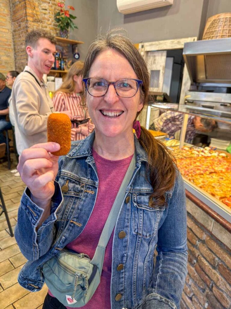 Celine Brewer tries suppli on a food tour during a 1-day visit to Rome with kids.