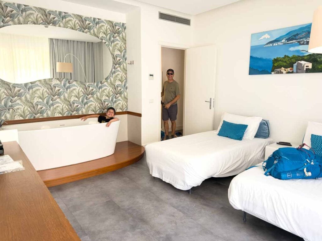 Dan Brewer, owner of FamilyCanTravel.com, and his son have some fun in their 1-bedroom suite in the Tasso Suites in Sorrento, Italy.