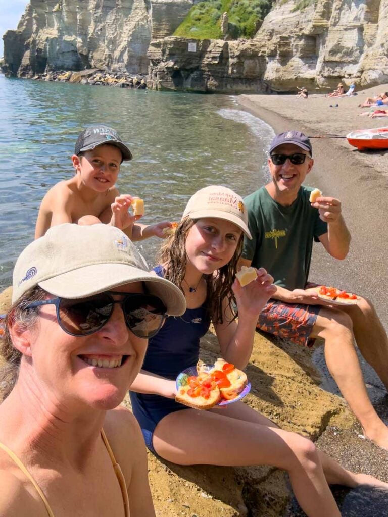 The Brewer family enjoys homemade bruschetta after a kid-friendly kayaking tour on a family trip to Ischia, Italy.