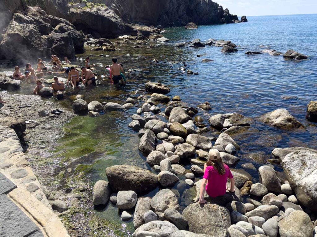 One of the Brewer kids visits the natural hot pools in the ocean at Sorgeto Bay on Ischia, Italy.