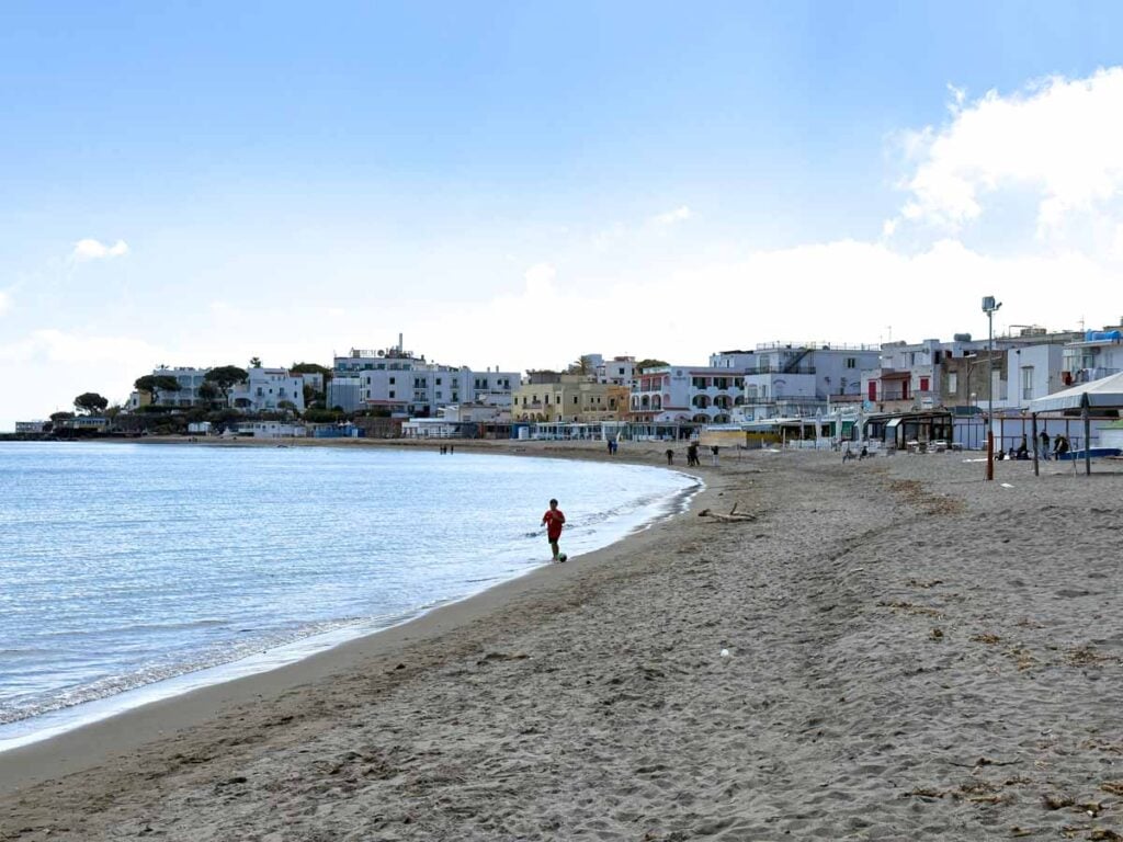 A real sand beach at Spiaggia di San Pietro on Ischia, Italy.