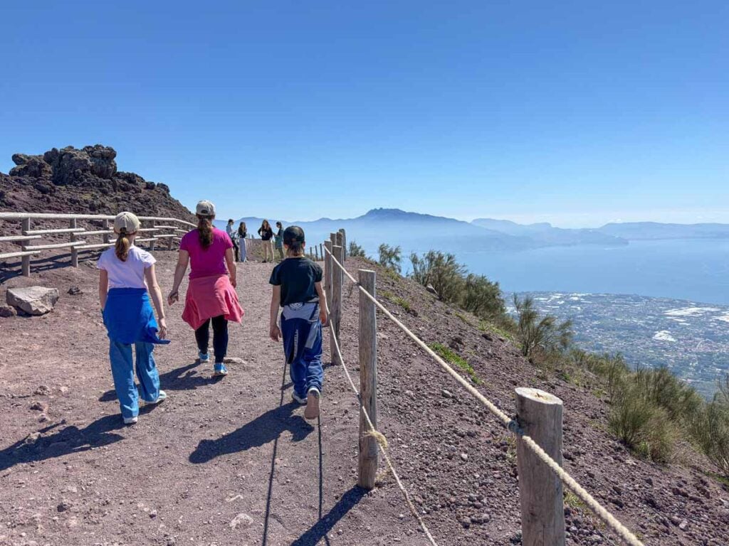 Celine Brewer, owner of FamilyCanTravel.com, hikes with her kids up the Gran Cono Trail on Mt. Vesuvius near Pompeii.