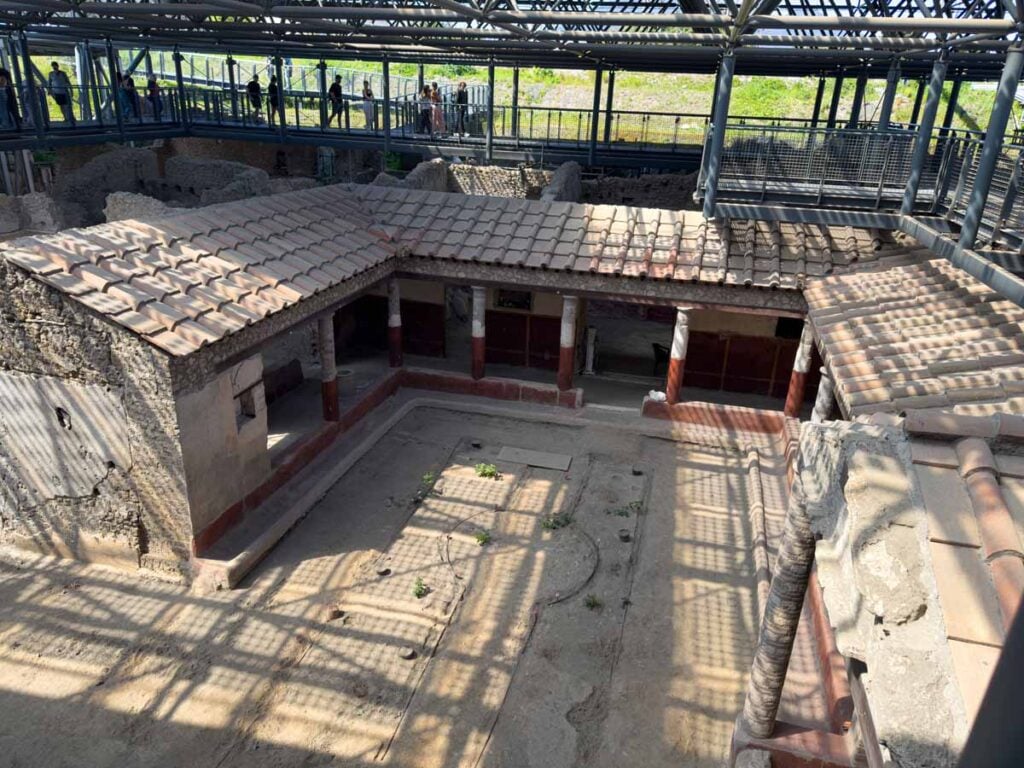Elevated walkways showcase ongoing excavations at the Pompeii ruins near Mt. Vesuvius, Italy.
