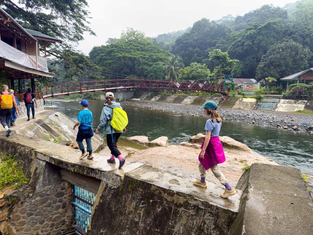 Celine Brewer and her kids walk to the bat cave near Bukit Lawang, Indonesia.