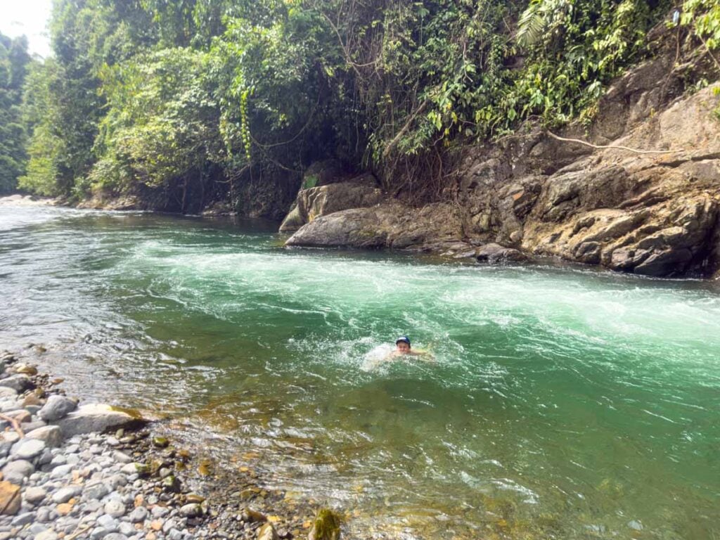 A Brewer child swims in a river during a family trip to Gunung Leuser National Park.