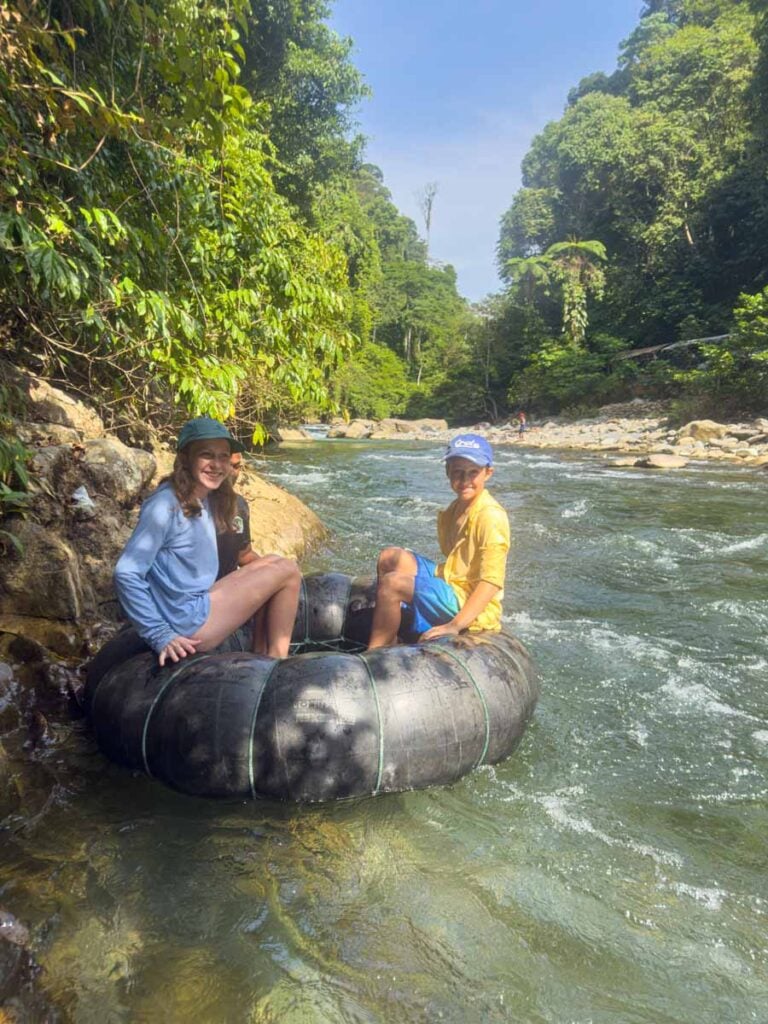 The Brewer kids sit on an inner tube on a river while on a camping trip in Gunung Leuser National Park, Indonesia.