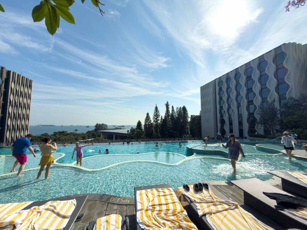 The Pamukkale pool overlooks the ocean at the Village Hotel Sentosa, one of our favourite family-friendly hotels in Singapore.