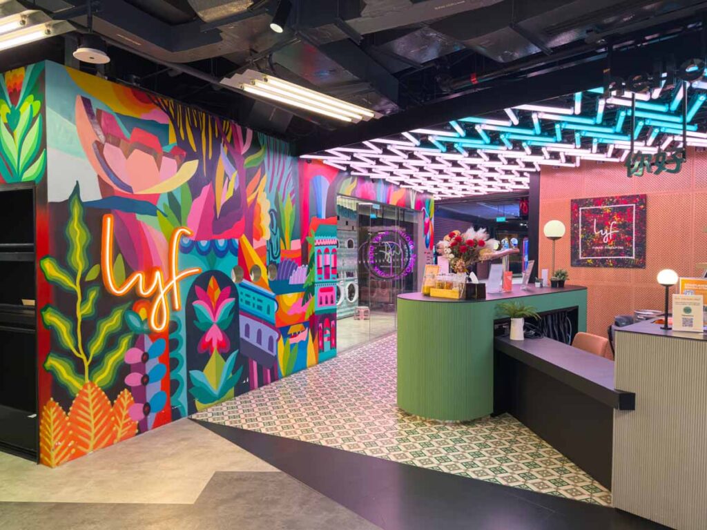 The fun and colourful lobby of the kid-friendly lyf Funan Singapore Hotel has a laundromat.