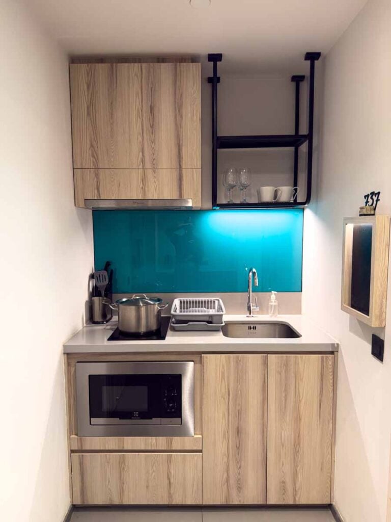 The common area in the Two of a Kind room at the lyf Funan Singapore hotel has a small but functional kitchenette.
