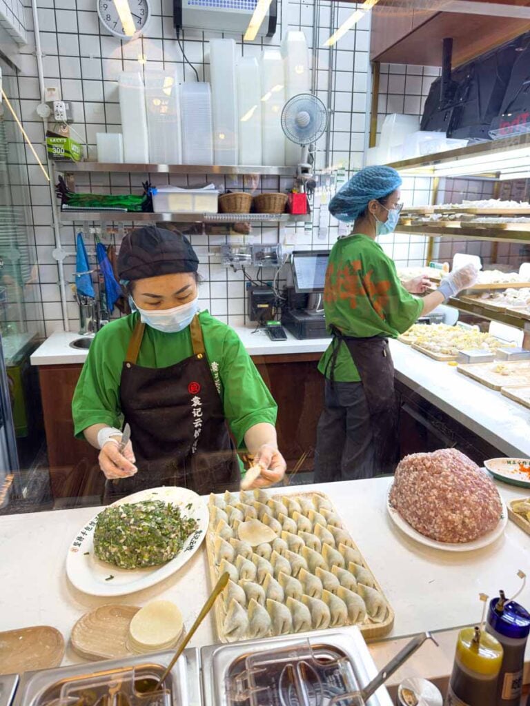 Chefs prepare dumplings at a restaurant in the Funan Centre Food Court in central Singapore.