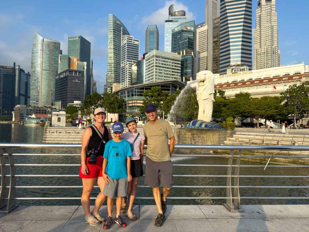 Dan and Celine Brewer, owners of FamilyCanTravel.com, visit the Merlion during a four day trip to Singapore with kids.