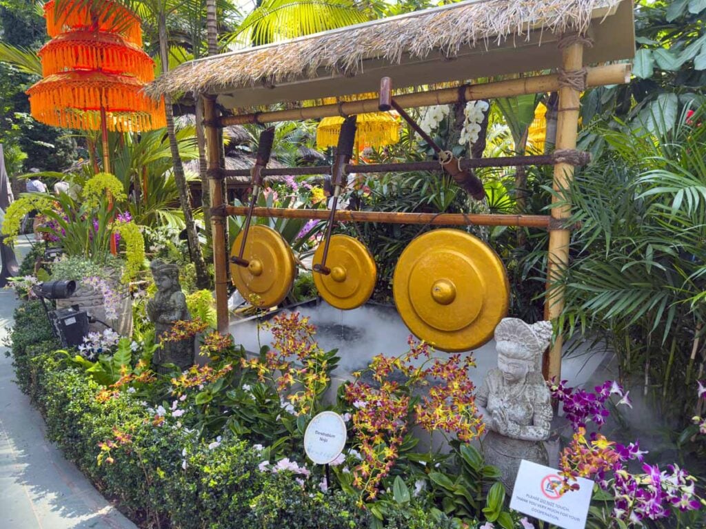 Water powered hammers hit gongs to make music at the Flower Dome in Singapore.