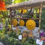 Singapore with Kids - Flower Dome Water Display Water powered hammers hit gongs to make music at the Flower Dome in Singapore.