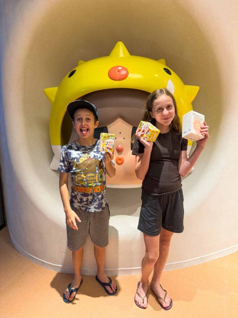 The Brewer kids show off their purchases at the very popular Pop Mart store on Sentosa Island.