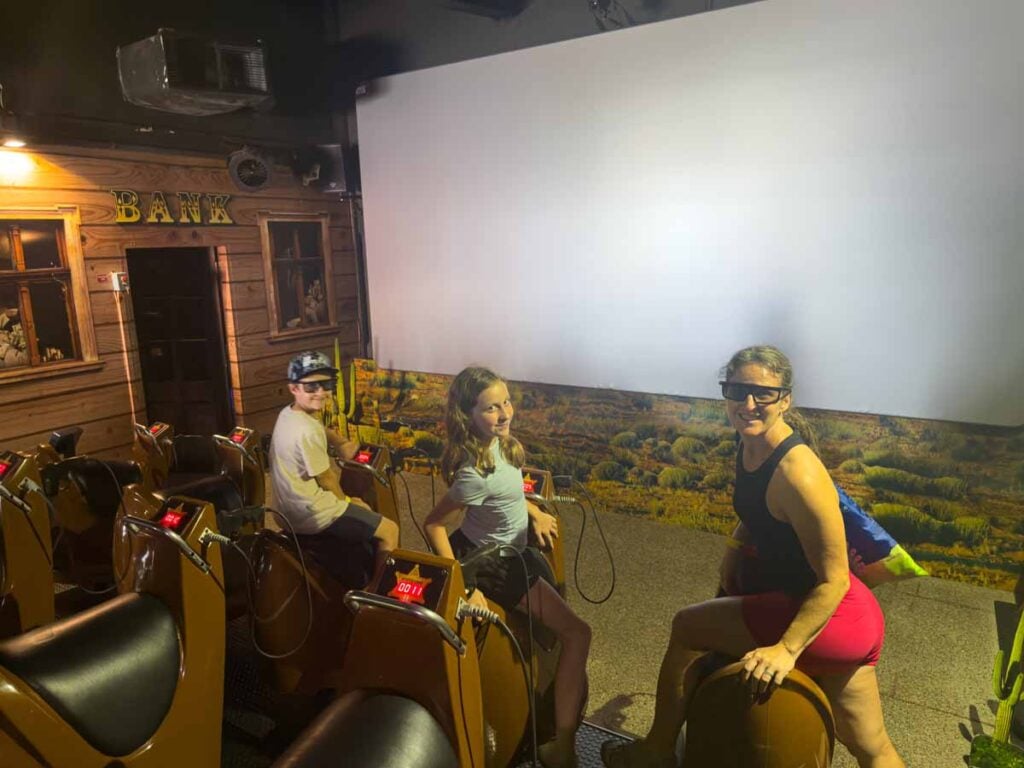 Celine Brewer, from the Family Can Travel blog, at the Desperado ride at 4D Adventureland at Sentosa Island in Singapore.