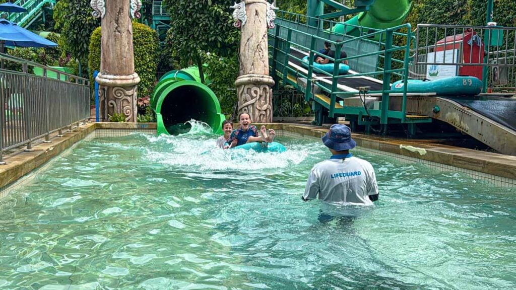The Brewer kids are all smiles as they exit the Riptide Rocket waterslide at Adventure Cove Waterpark in Sentosa.