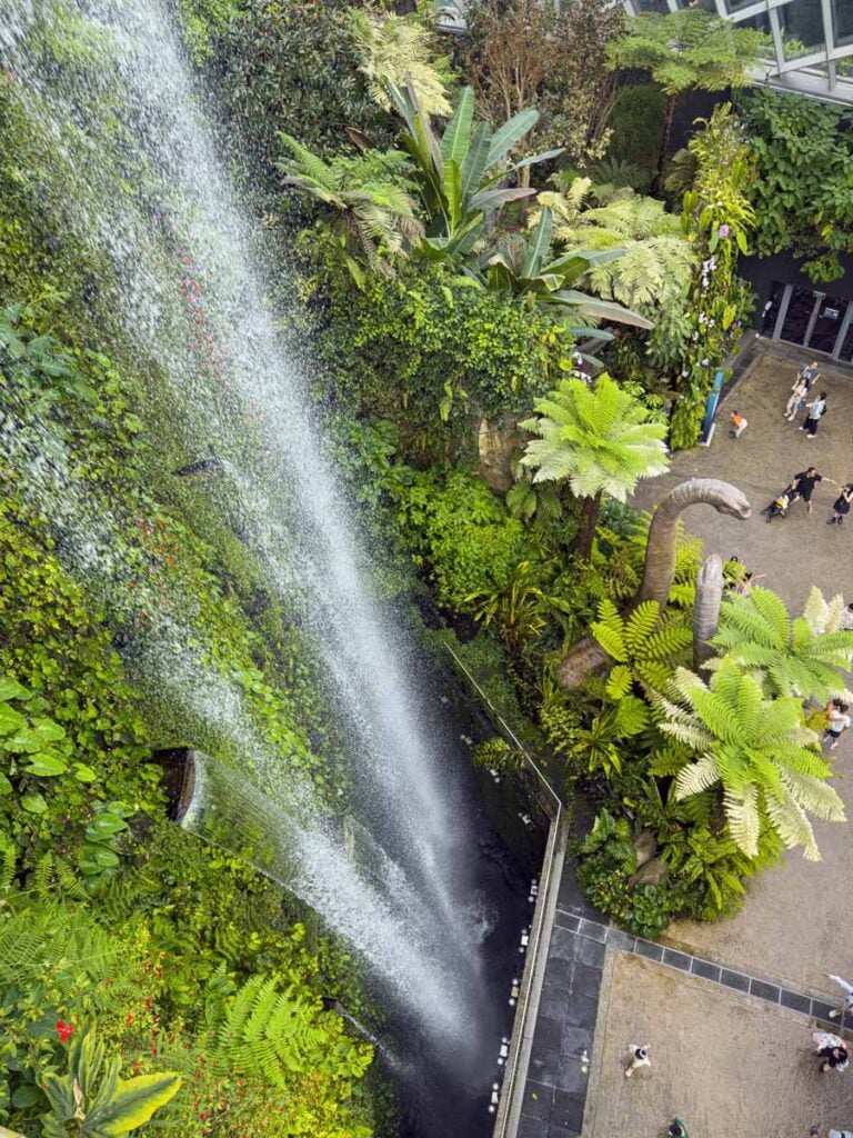 The view of the towering entrance waterfall from the top level of the Cloud Forest at Gardens by the Bay.