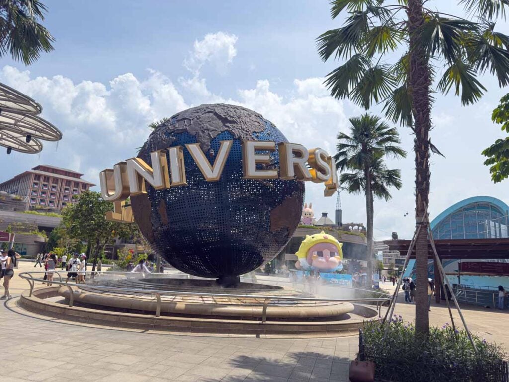 The Universal globe sign spins outside the entrance to the theme park in Sentosa.