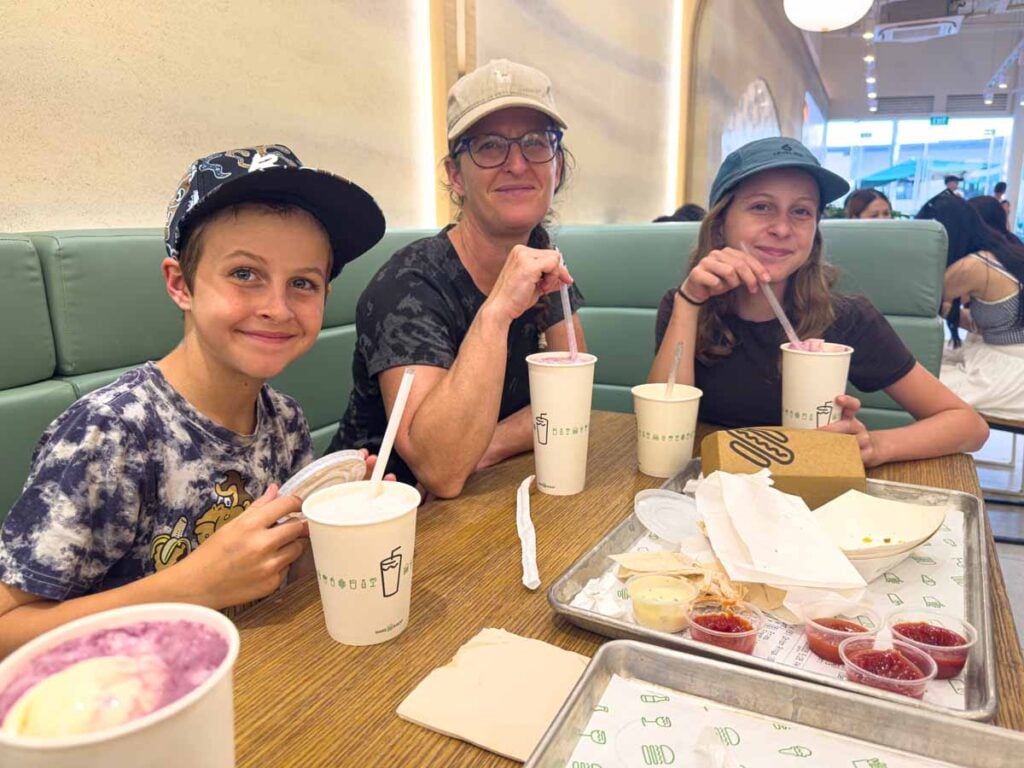 Celine Brewer and her kids eat familiar food at Shake Shack in Sentosa, Singapore.