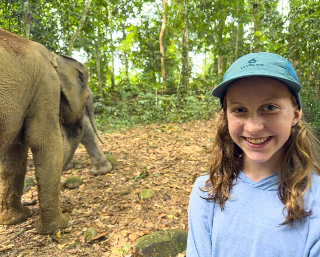 A Brewer child enjoys an encounter with Sumatran elephants on a family trip to Bukit Lawang.