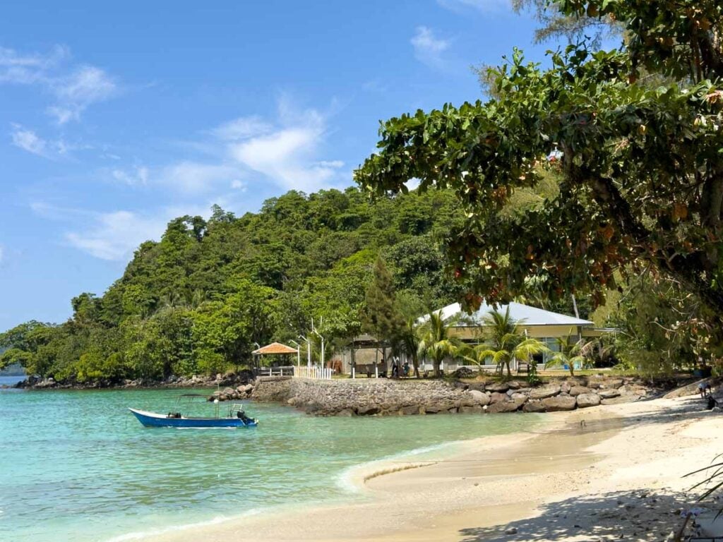 A boat in the shallow waters off Gapang Beach, Pulau Weh, Indonesia.