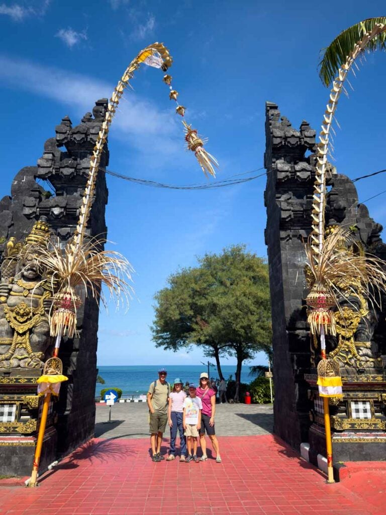 Dan and Celine Brewer, visit Tanah Lot with their kids on a sightseeing tour of the top attractions in Bali, Indonesia.
