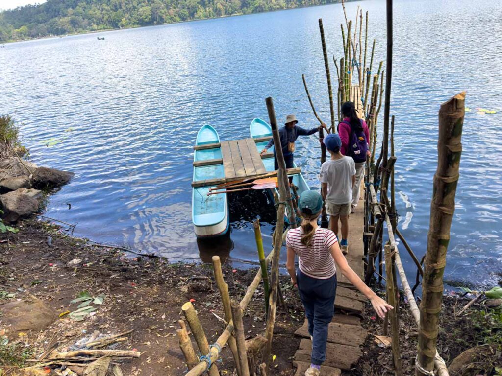 The Brewer's boarding their canoe on Lake Tamblingan in Bali.