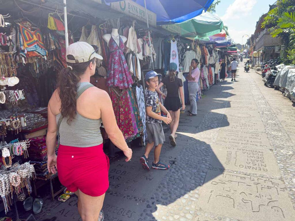 Celine Brewer and her kids go souvenir shopping in the Ubud Art Market.