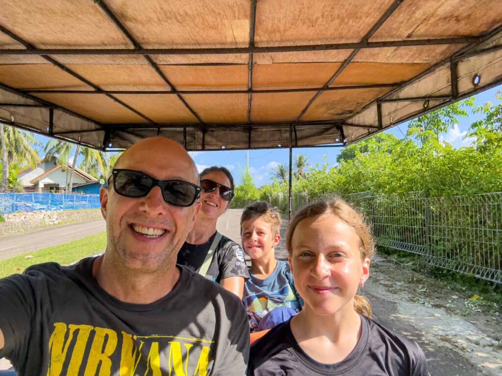 Dan and Celine Brewer, owners of the Family Can Travel blog, enjoy a tuk tuk tour while on Pulau Weh with kids.