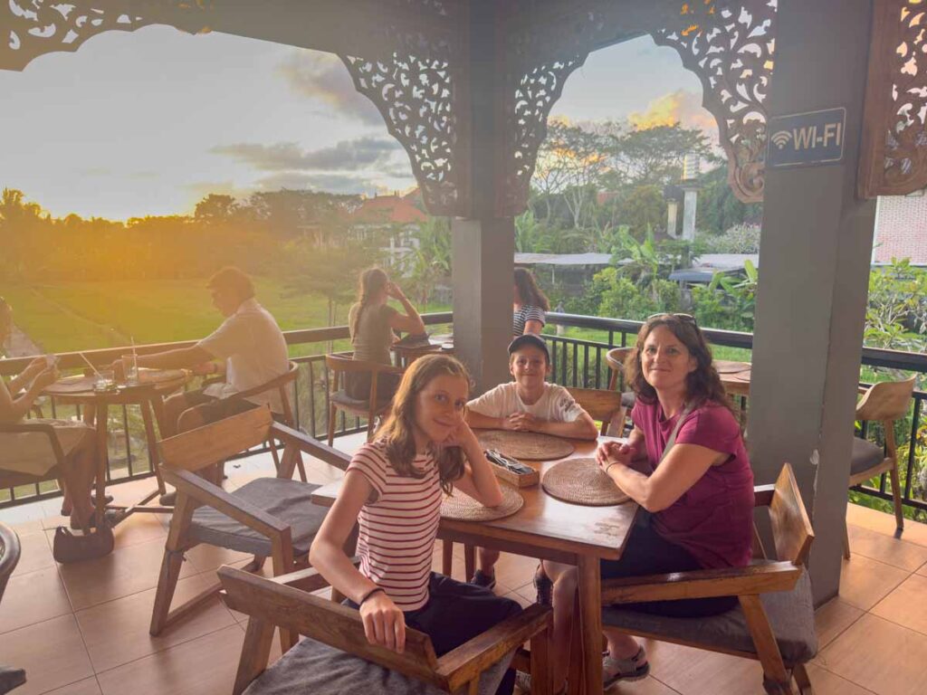 Celine Brewer and her kids enjoy watching the sunset while dining at Bisma Sunset Corner in Ubud.