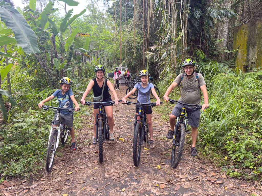 Celine and Dan Brewer, owners of FamilyCanTravel.com, on a family-friendly bike tour in northern Bali.